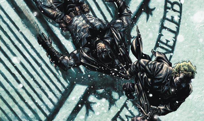 Batman dragged through the snow by The Joker in Batman Noël