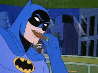 Batman chomping on cookies